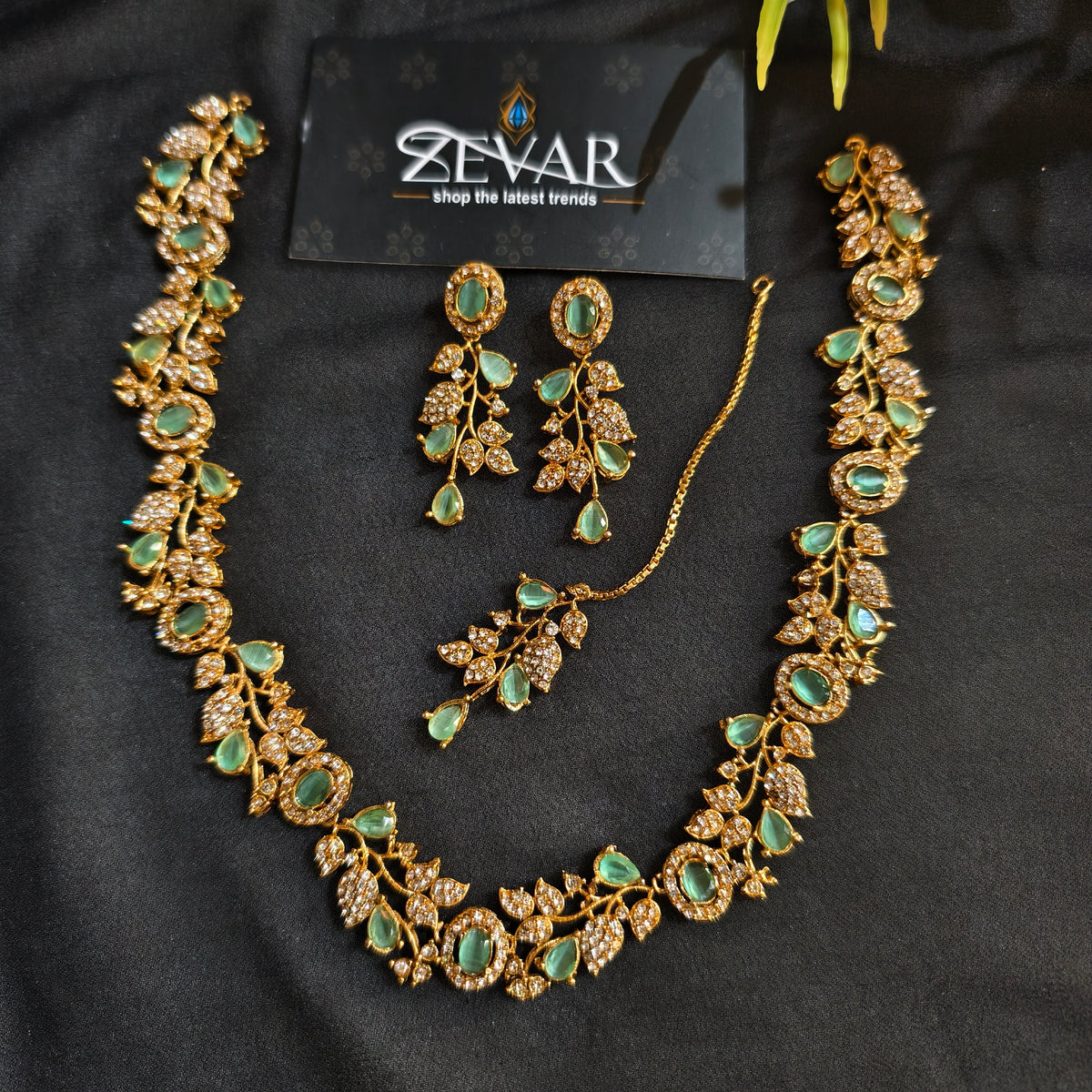 Sleek Leaf Pattern Party Wear Jewellery Set with Earrings & Maang Tikka | Zevar