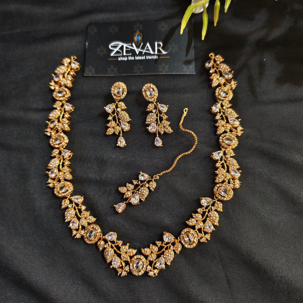 Sleek Leaf Pattern Party Wear Jewellery Set with Earrings & Maang Tikka | Zevar